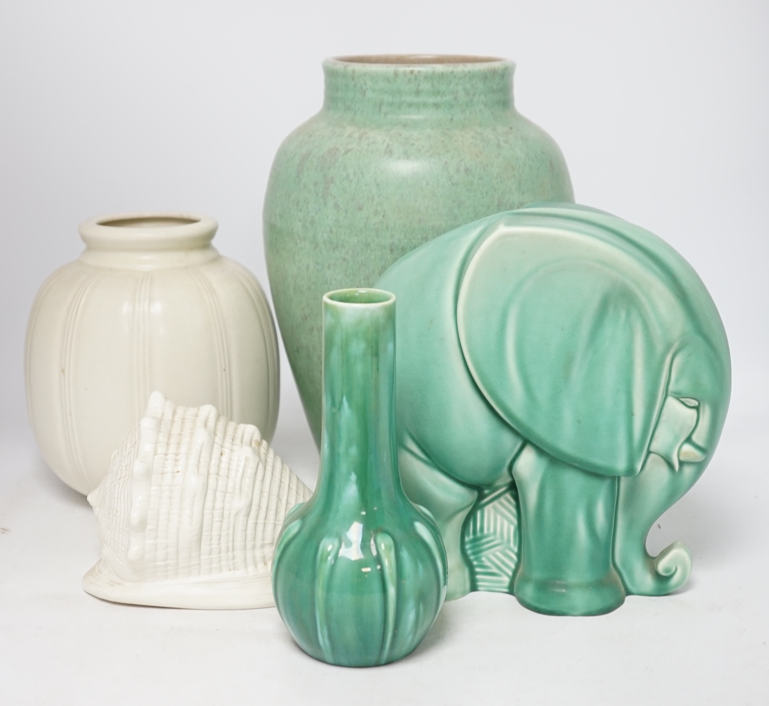 An Art Deco Spode's Royal Jade green glazed model of an elephant and four other pieces of Poole, Royal Lancastrian and Wedgwood, tallest 29cm. Condition - good